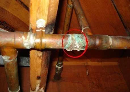 Copper plumbing pipe damage and corrosion from exposure to acidic condensate without a neutralizer.